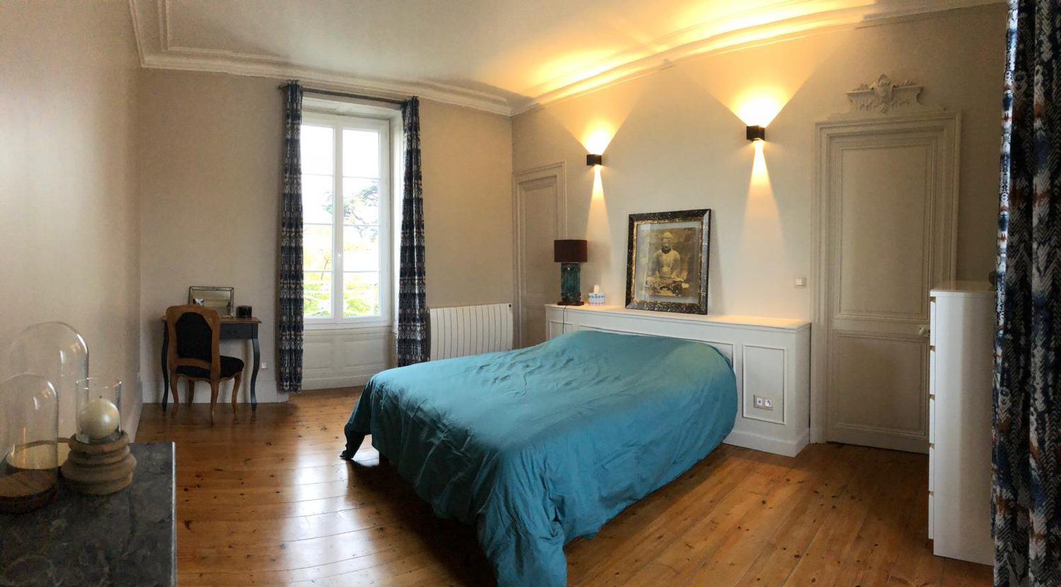 A bedroom, marble fireplace